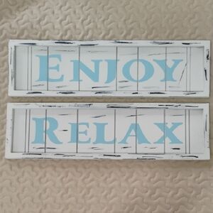 A pair of Enjoy / Relax Wall Signs in Light Blue and White 18 inch x 5 inch